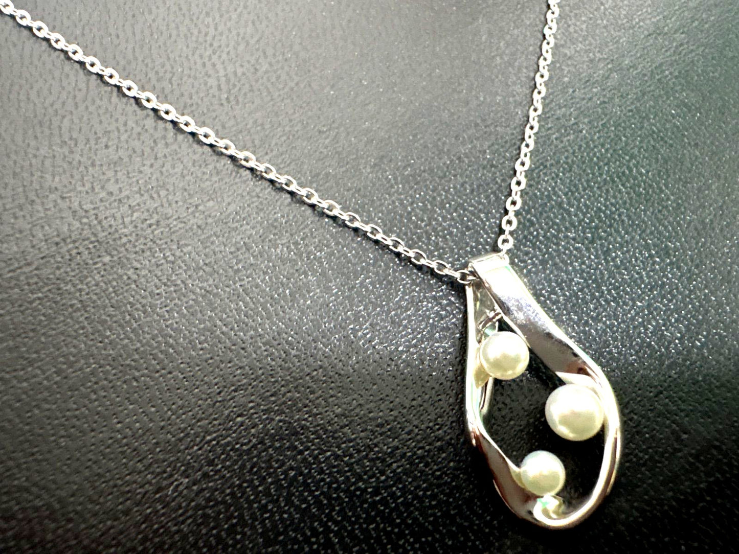 Mikimoto silver pearl necklace with 39.5cm length and sterling silver stamp shown on white background