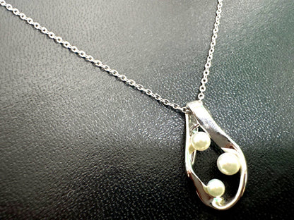 Mikimoto silver pearl necklace with 39.5cm length and sterling silver stamp shown on white background