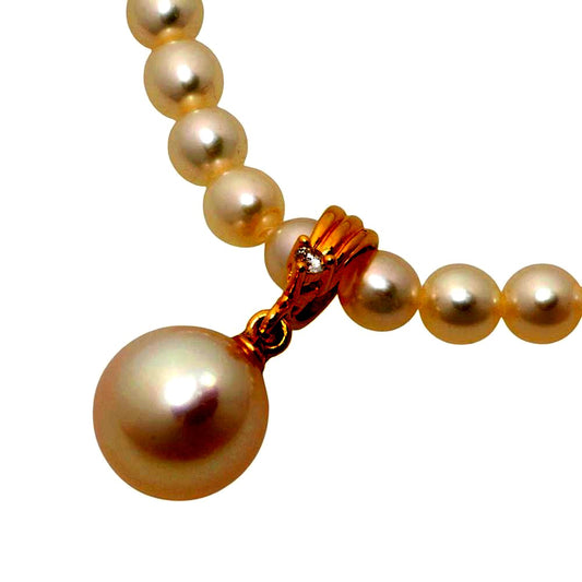 Tasaki pearl necklace with 18k yellow gold chain, freshwater Akoya pearls, and small melee diamonds
