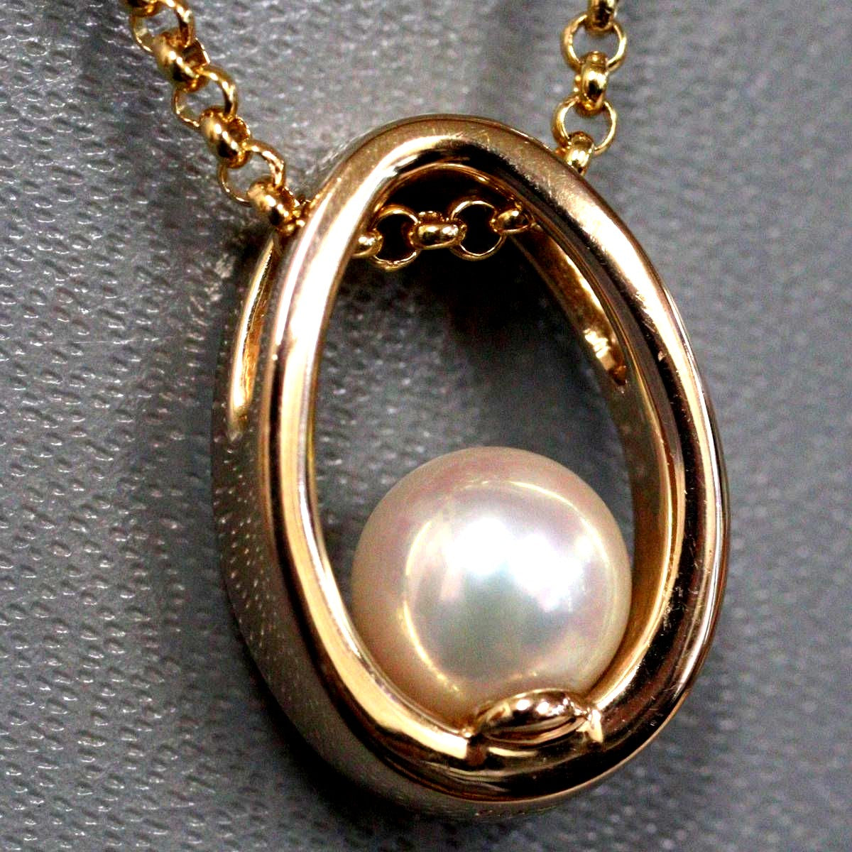 Mikimoto K18 yellow gold pearl pendant with 42cm chain, measuring 11mm by 16mm, weighing 7.1g
