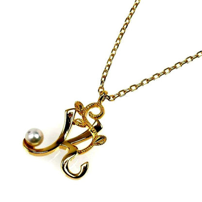 Mikimoto Baby Pearl Initial K Necklace featuring a yellow gold pendant and delicate chain