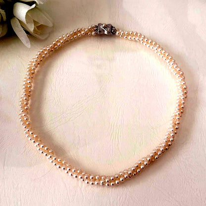 188 Tasaki silver three-row necklace featuring baby pearls and a ribbon clasp, 42.5 cm length
