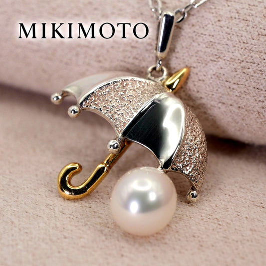 Mikimoto Umbrella Necklace made of silver, K18 gold, and pearl shown on a white background