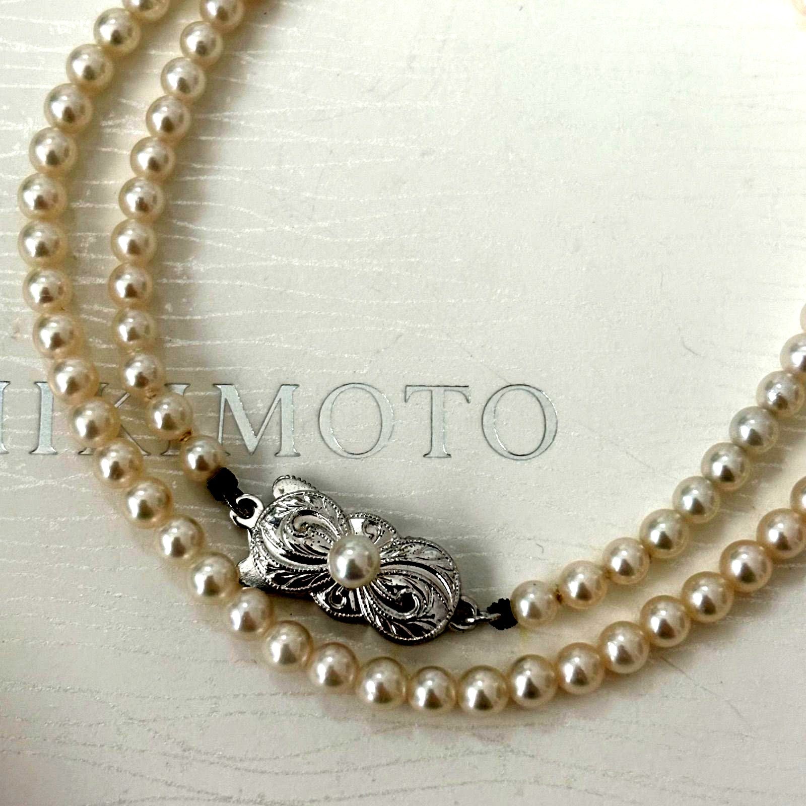 469 Mikimoto silver necklace featuring baby pearls with a 40cm length and silver clasp with minor scratches