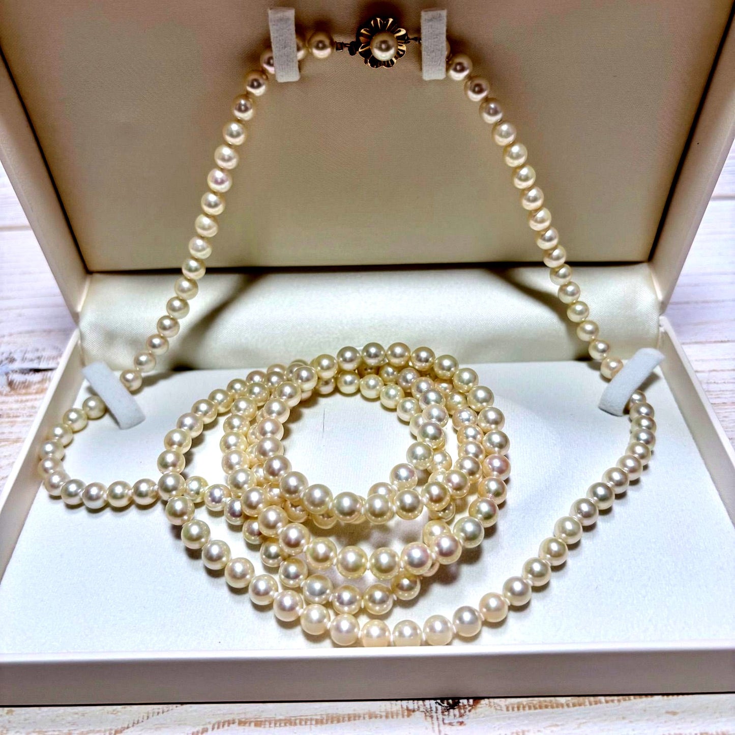 K14 Akoya pearl necklace with 7mm pearls, 127cm long, displayed on a white background
