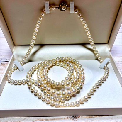 K14 Akoya pearl necklace with 7mm pearls, 127cm long, displayed on a white background