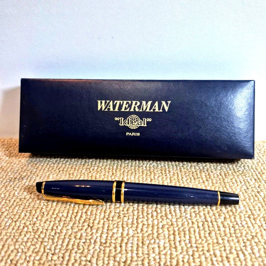 Waterman Expert fountain pen in blue with gold trim and fine nib, displayed with original stained box