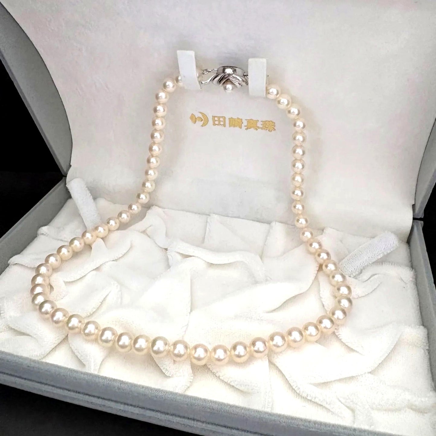 TASAKI Akoya pearl necklace featuring 6.5-7.0mm pearls and silver clasp on a 43cm strand