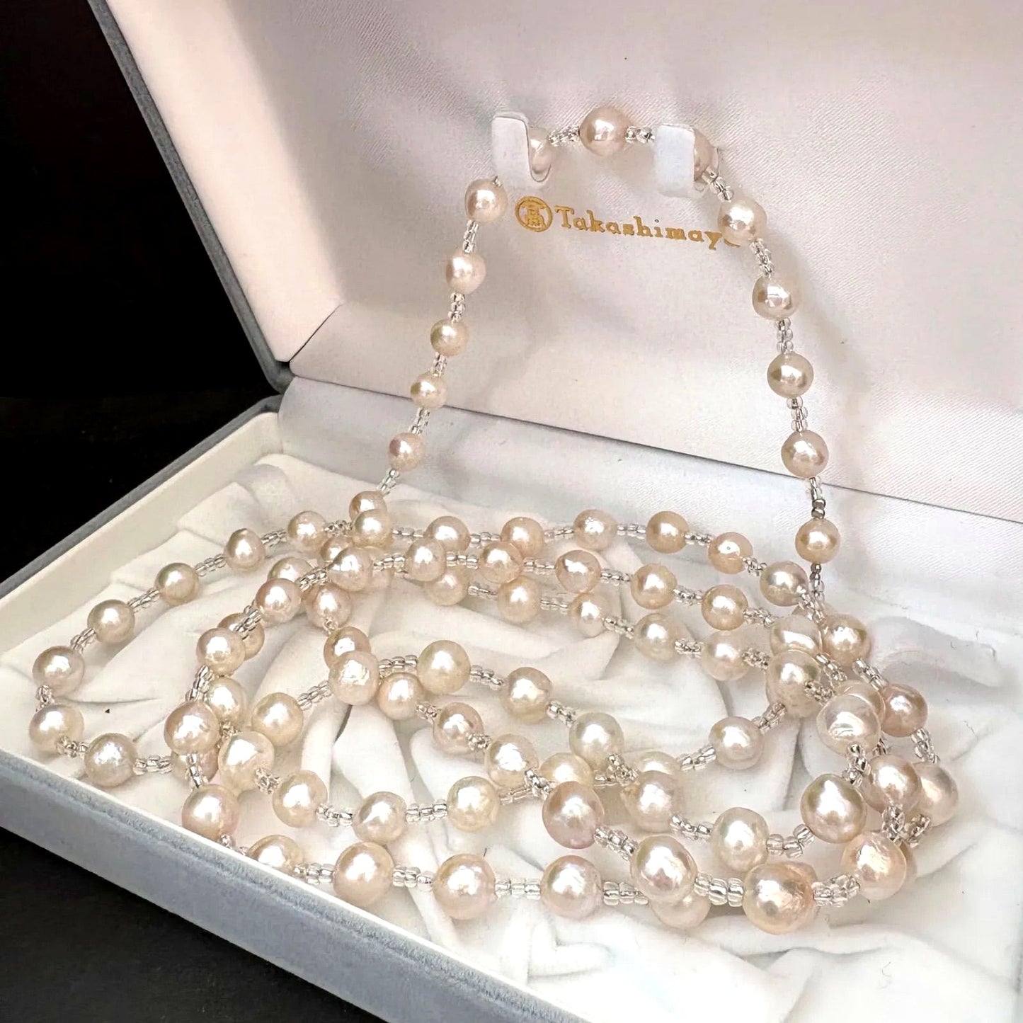 Long necklace featuring lustrous baroque Akoya pearls and crystal beads measuring about 120cm