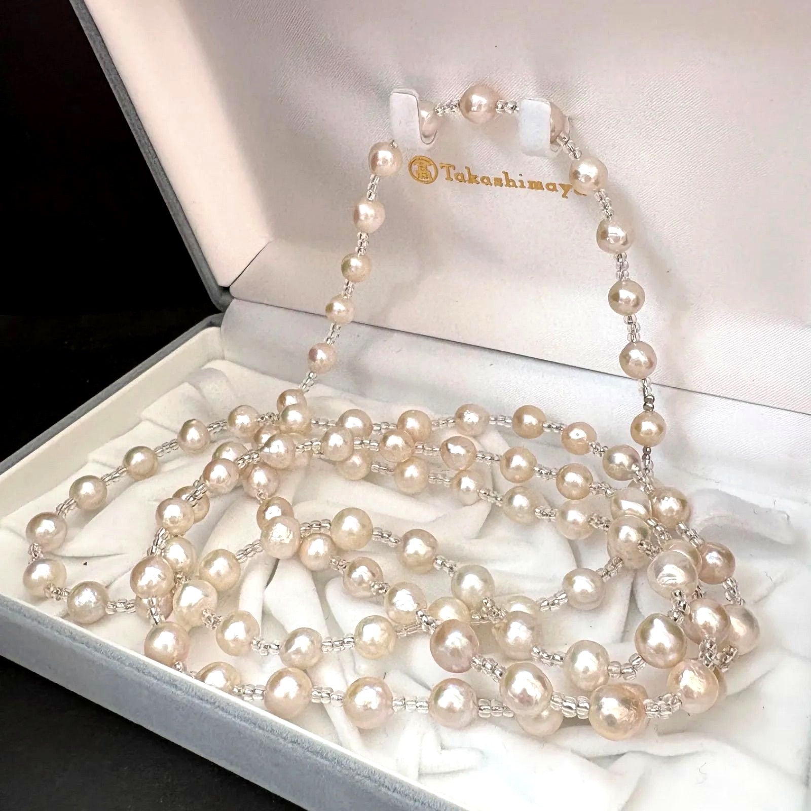 Long necklace featuring lustrous baroque Akoya pearls and crystal beads measuring about 120cm