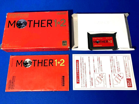 MOTHER1+2 game cartridge with damaged box and manual showing visible scratches and wear