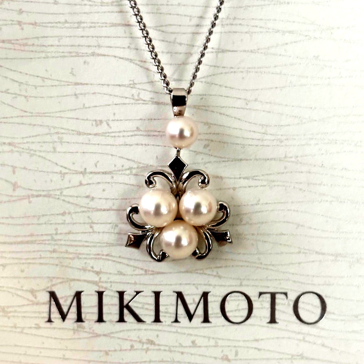 370 Mikimoto silver necklace with round pearls and 42cm length on a white background