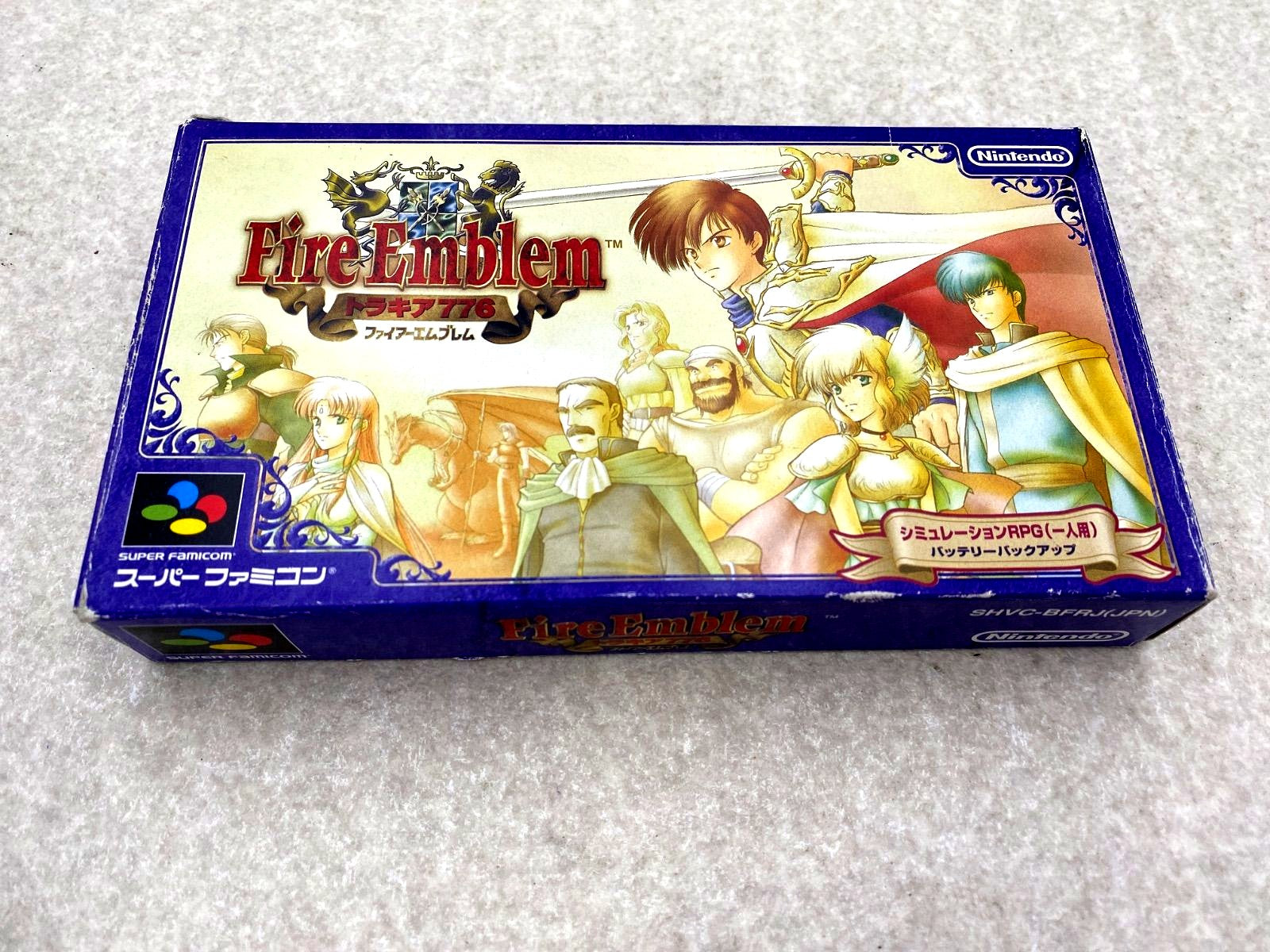 Fire Emblem Thracia 776 SNES game cartridge with damaged box and condition notes