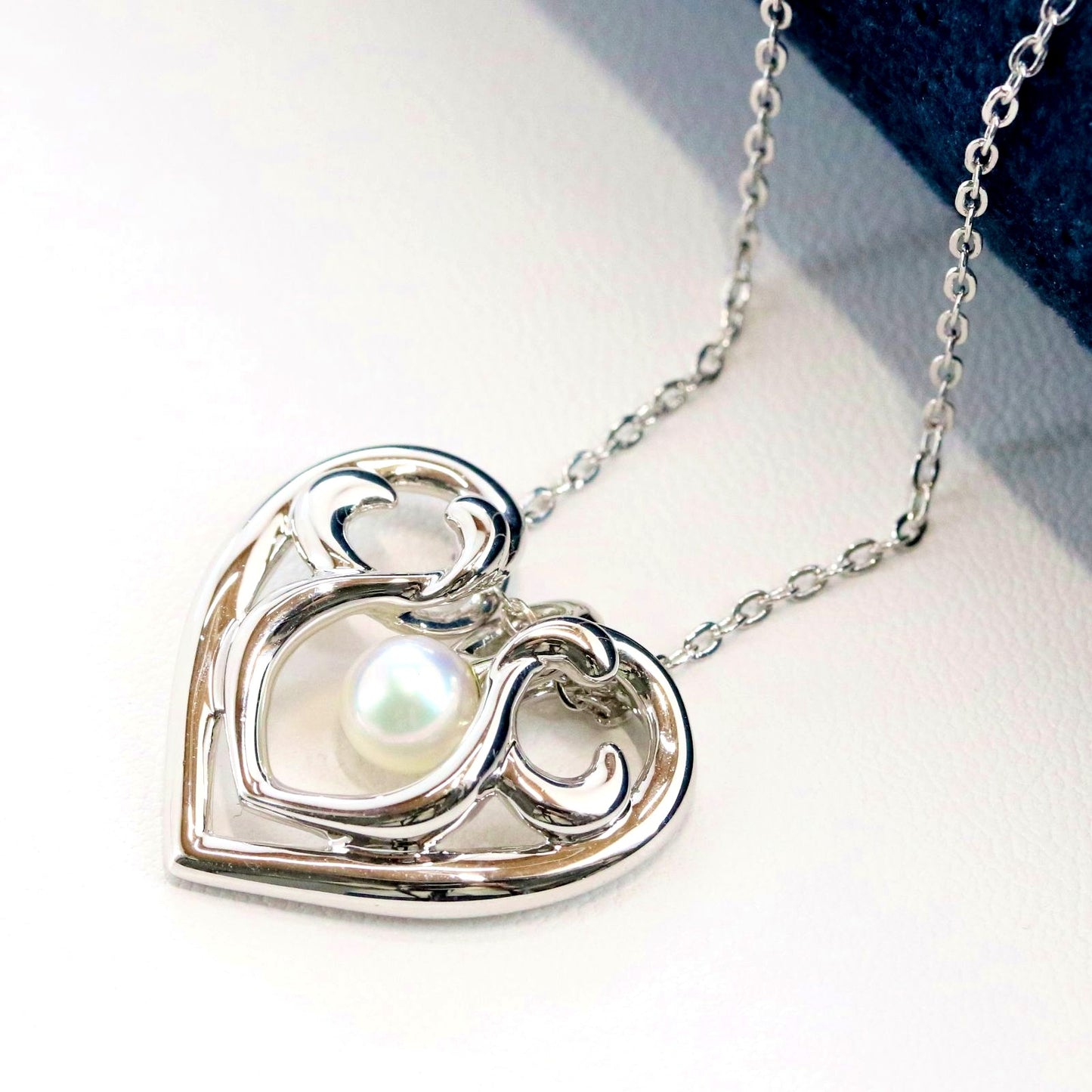 Micimoto silver necklace with a pearl heart pendant, showcasing a 3WAY design and delicate craftsmanship