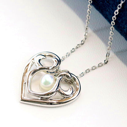 Micimoto silver necklace with a pearl heart pendant, showcasing a 3WAY design and delicate craftsmanship