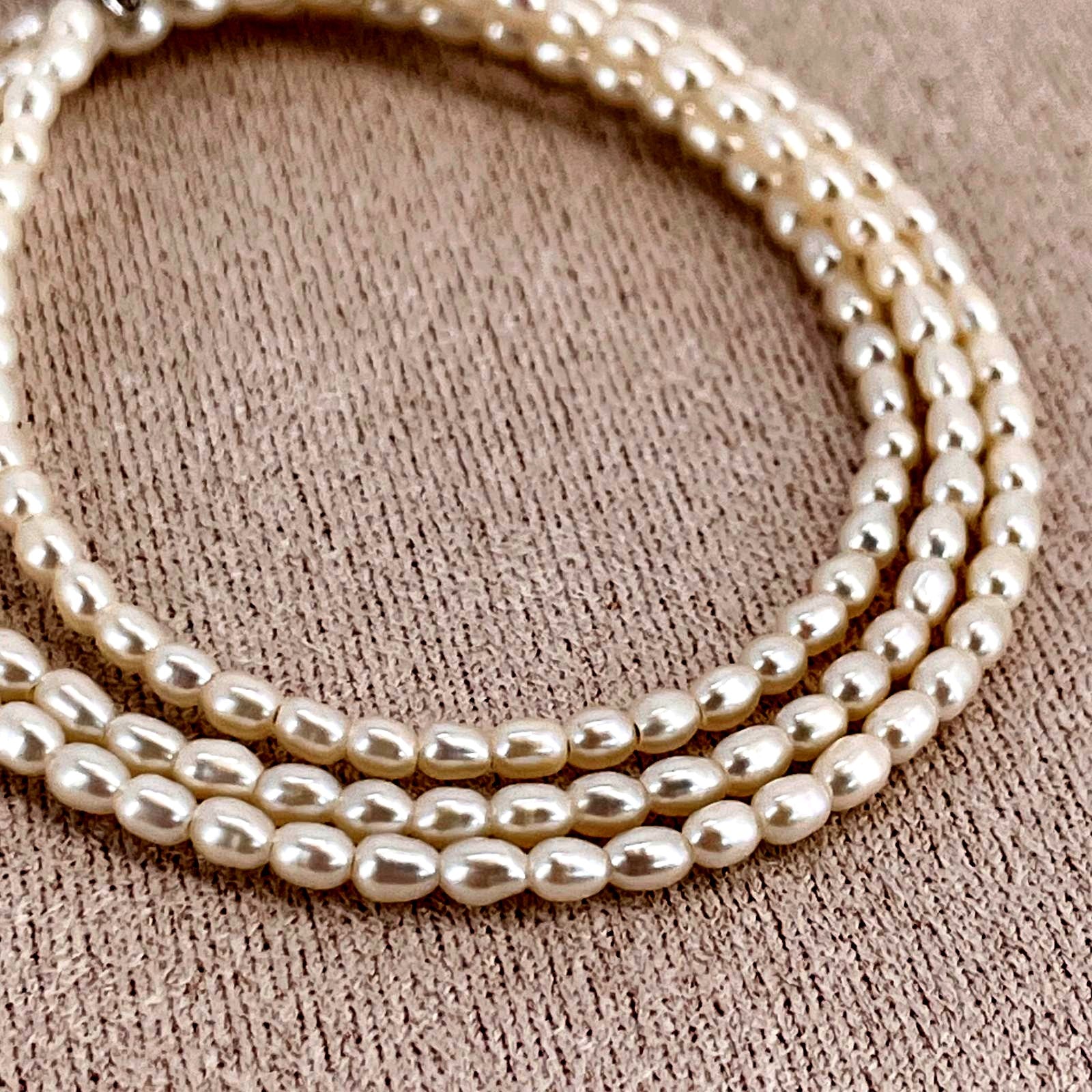 Mikimoto pearl necklace with small freshwater pearls set in K18WG white gold displayed on a white background