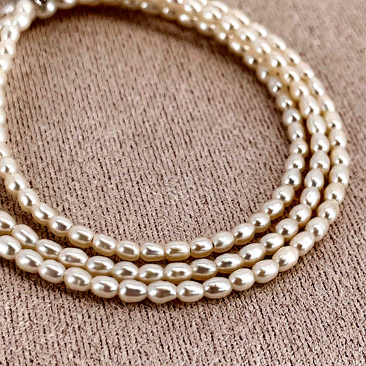 Mikimoto pearl necklace with small freshwater pearls set in K18WG white gold displayed on a white background