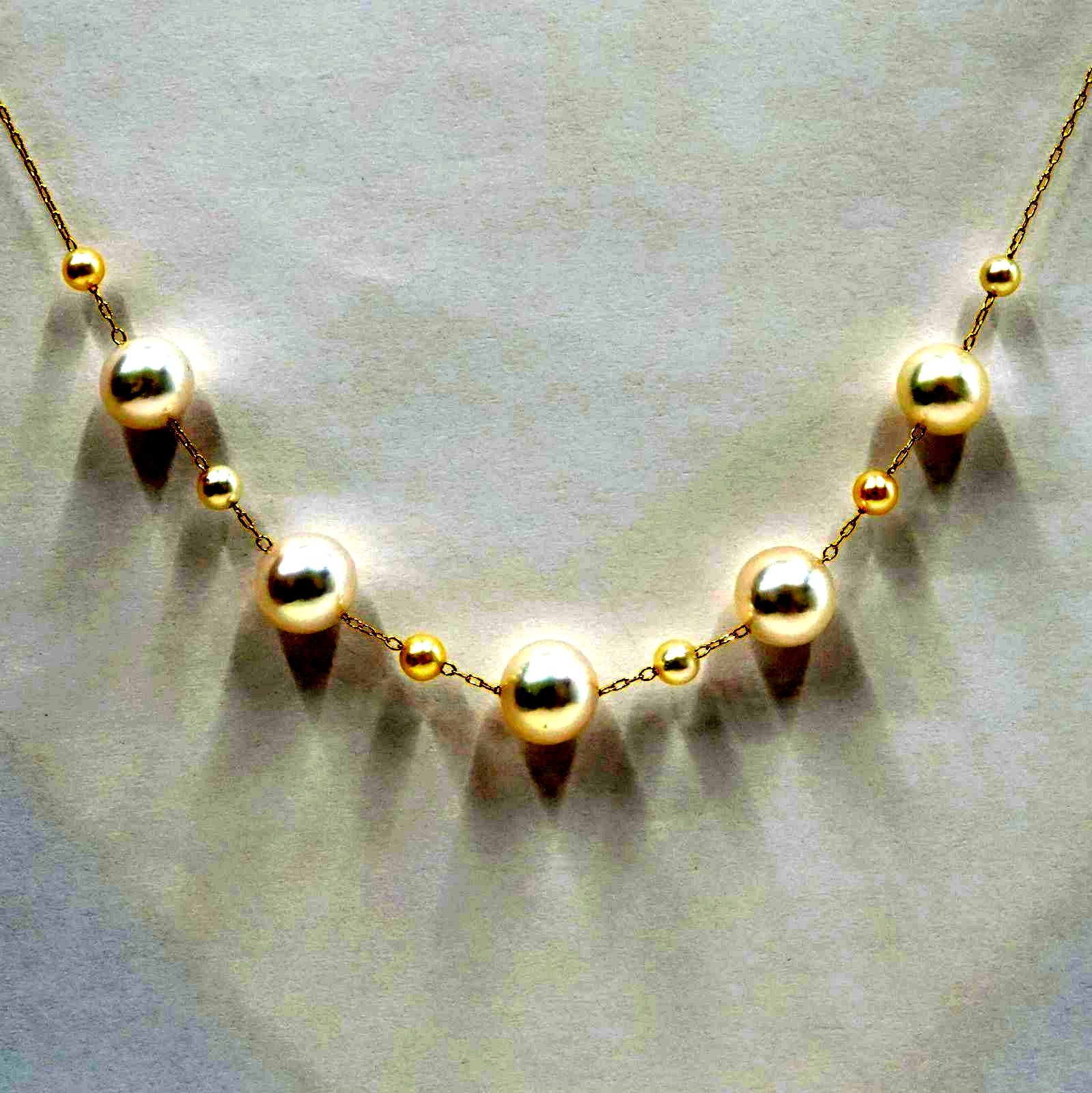 Perlagione Akoya pearl necklace with 7mm pearls and 3mm baby pearls on 44cm K14 yellow gold chain