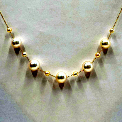 Perlagione Akoya pearl necklace with 7mm pearls and 3mm baby pearls on 44cm K14 yellow gold chain