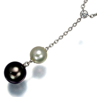 Mikimoto necklace with 9.4mm black pearl, 7.3mm Akoya pearl, diamonds, and white gold chain
