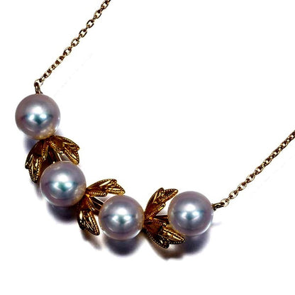 Mikimoto necklace featuring 5.8mm Akoya pearls with a leaf-shaped K18 yellow gold pendant, 48cm length