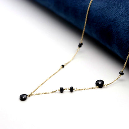 Agete K10 gold necklace with black onyx and slide adjuster on a white background