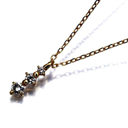 Mikimoto necklace in 18K yellow gold with three diamonds totaling 0.24ct, 39cm chain length