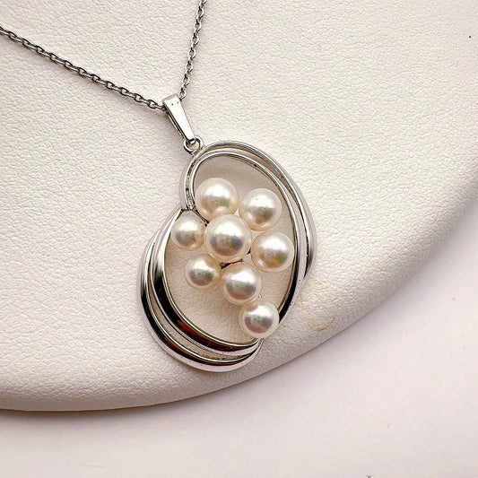 Mikimoto grape motif necklace in silver tone featuring a 5mm pearl and 45cm silver chain