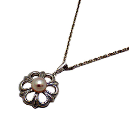 Mikimoto Flower Necklace featuring silver chain with delicate pearl flower pendant