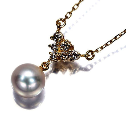 Mikimoto necklace featuring a 7.6mm Akoya pearl pendant with diamond accents set in 18K yellow gold on a 39cm chain