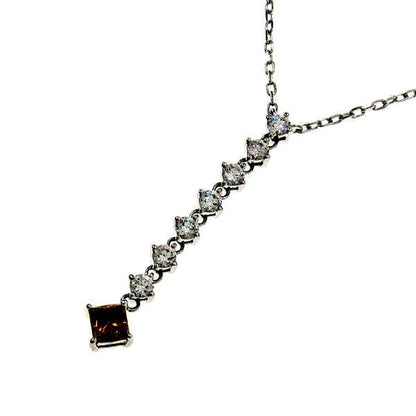 Mikimoto white gold diamond necklace with 7 round cut and 1 square cut diamonds, 40 cm length