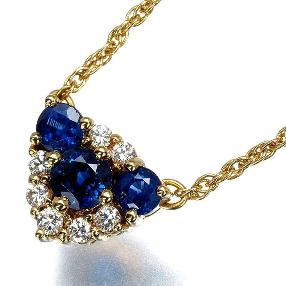 Mikimoto necklace with sapphire and diamond pendant set in 18K yellow gold, showing detailed gemstones and chain