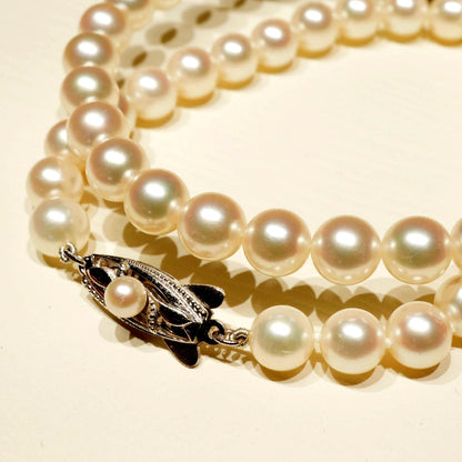 Mikimoto K14WG Akoya Pearl Necklace featuring white pearls sized 6.6 to 6.9 mm on a sterling white gold chain
