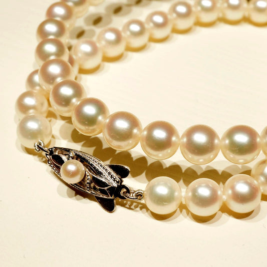 Mikimoto K14WG Akoya Pearl Necklace featuring white pearls sized 6.6 to 6.9 mm on a sterling white gold chain