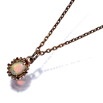 Agete necklace with opal pendant in 10 karat yellow gold featuring a delicate 36-41 cm chain