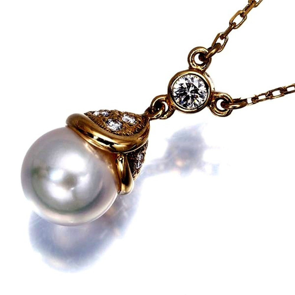 Mikimoto pearl necklace with 8.7mm pearl, diamonds, and 18K yellow gold chain 40cm long