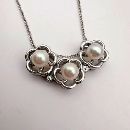 Tasaki pearl necklace featuring 6.2mm pearls, 41.5cm chain, and 1.1cm by 3.4cm pendant