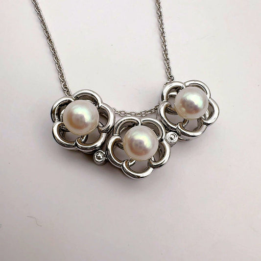 Tasaki pearl necklace featuring 6.2mm pearls, 41.5cm chain, and 1.1cm by 3.4cm pendant