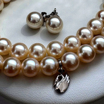Tasaki Akoya pearl necklace and earrings set with swan charm and certificate