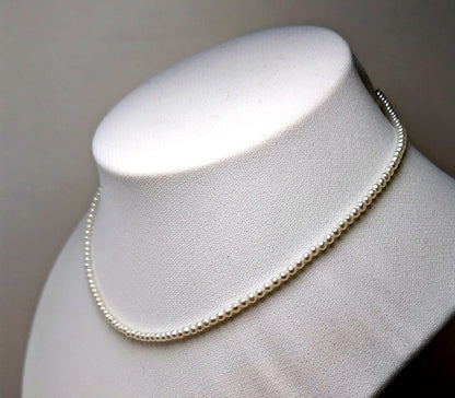 Baby 3mm white Akoya and freshwater pearl necklace with semi-round pearls and good luster
