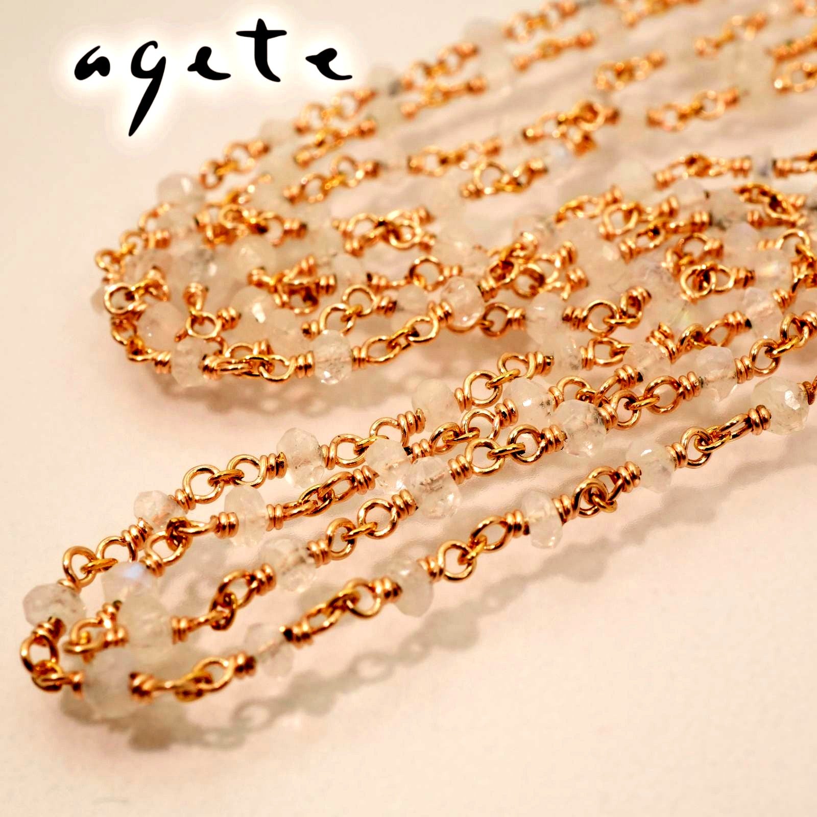 Agete long necklace made of silver with a labradorite stone pendant