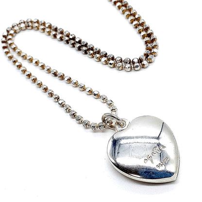 Agete heart-shaped silver necklace with heart rocket and clover charm on silver chain