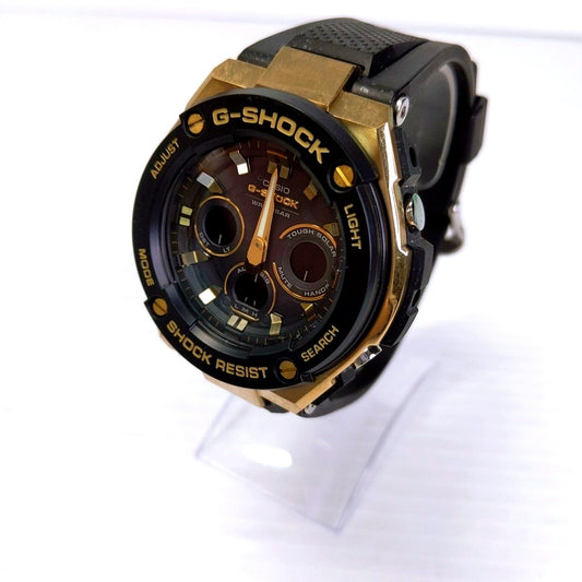 Used Casio G-Shock GST-W300G-1A9JF men's gold watch with visible minor scratches