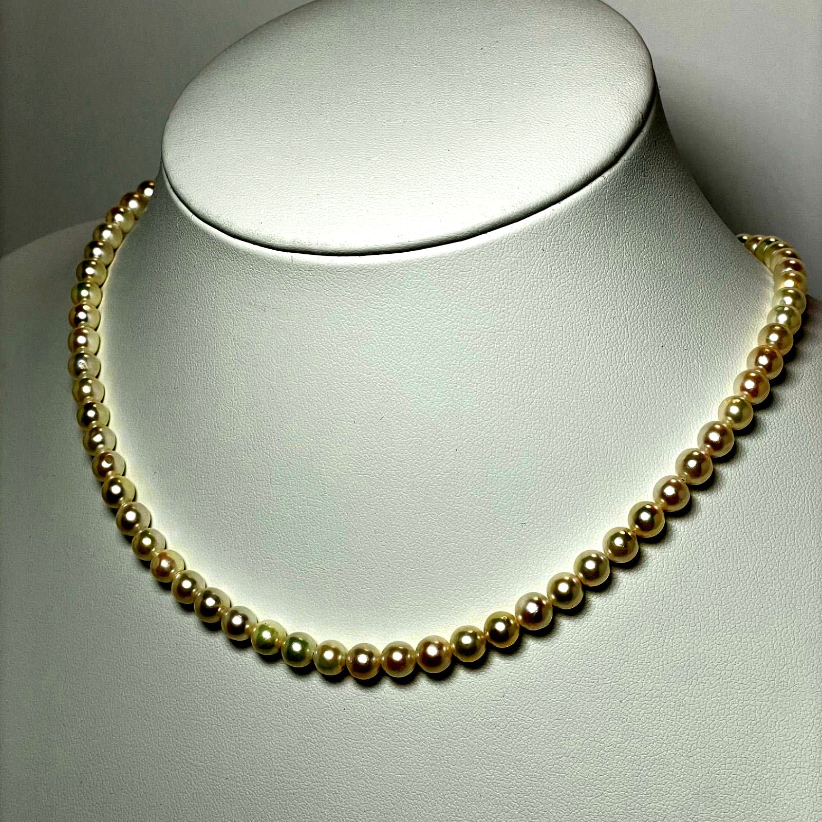 Akoya pearl necklace featuring 5.5-6.0mm pearls with a 42cm length on a white background