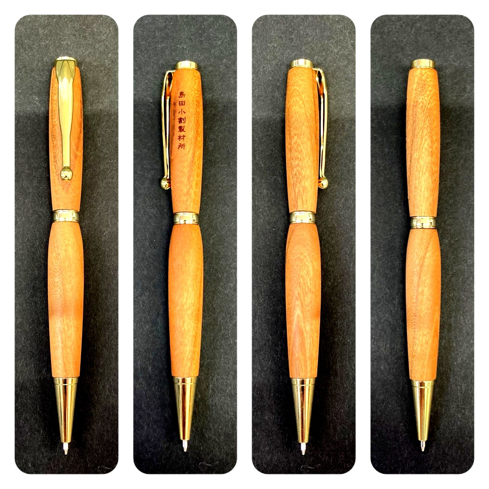 Shimada Kowari hand-carved cherry wood ballpoint pen approximately 13 cm long with natural grain texture