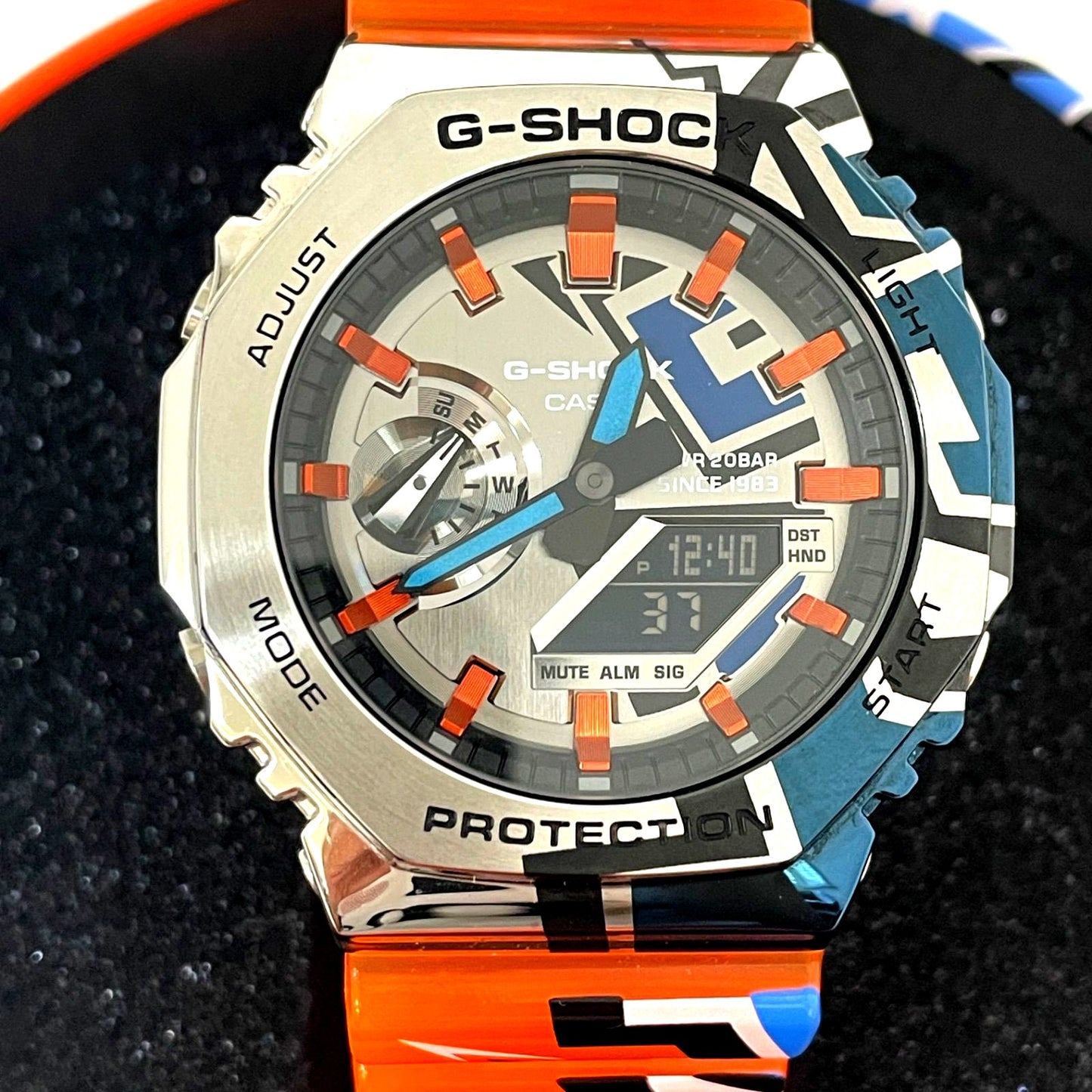 Casio G-Shock GM-2100SS-1AJR digital analog combination watch with metal case and orange band