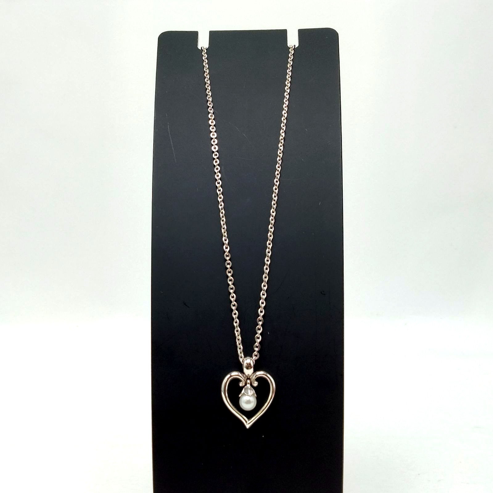 MIKIMOTO silver heart necklace with a 0.5cm pearl pendant and 19cm chain on white background