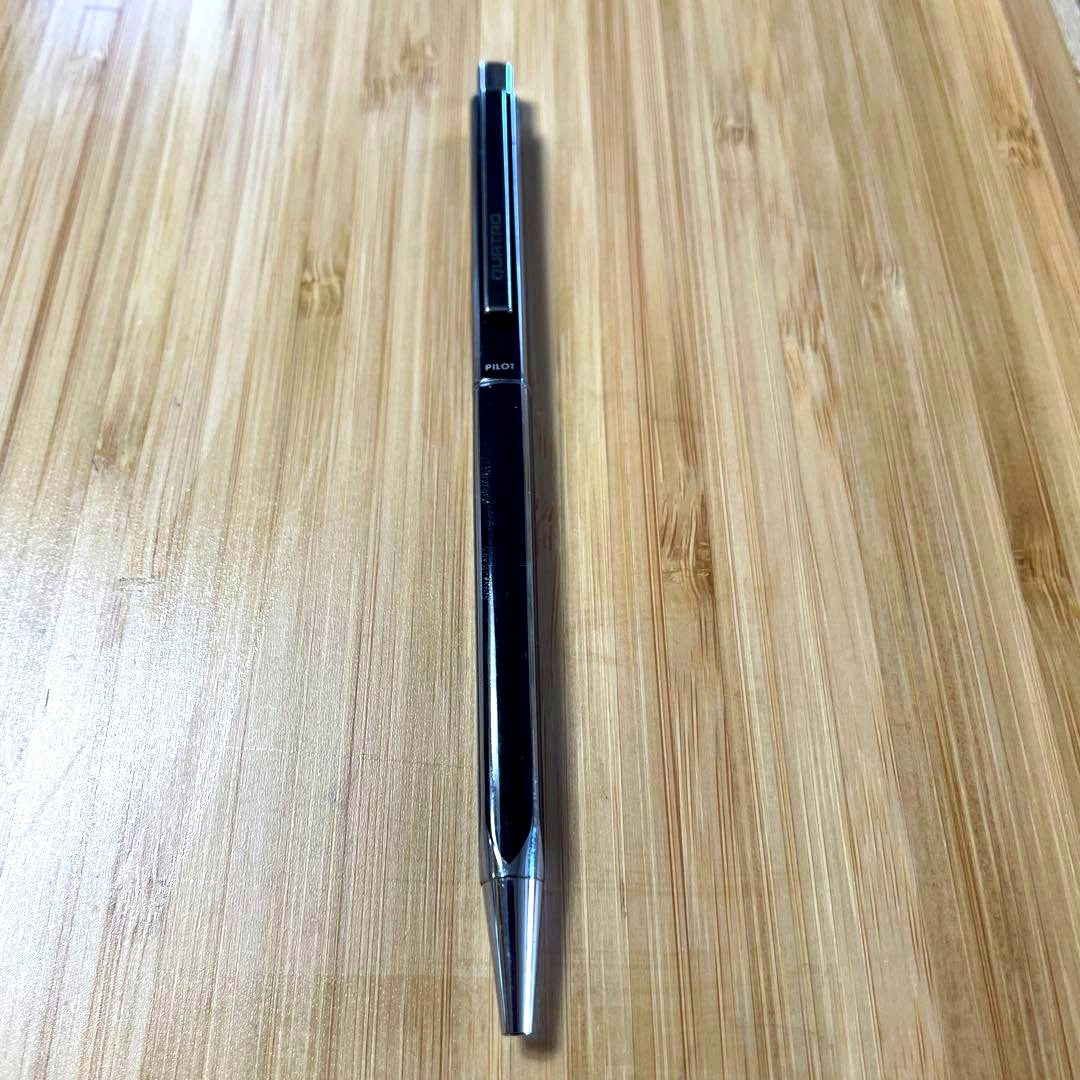 PILOT Quattro black ballpoint pen shown with cap and medium point tip