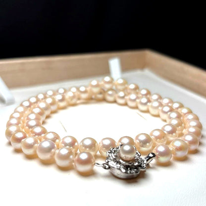 Akoya pearl necklace with 7.0-7.5mm round white pearls, 43cm length, teri wrapped with silver stamp
