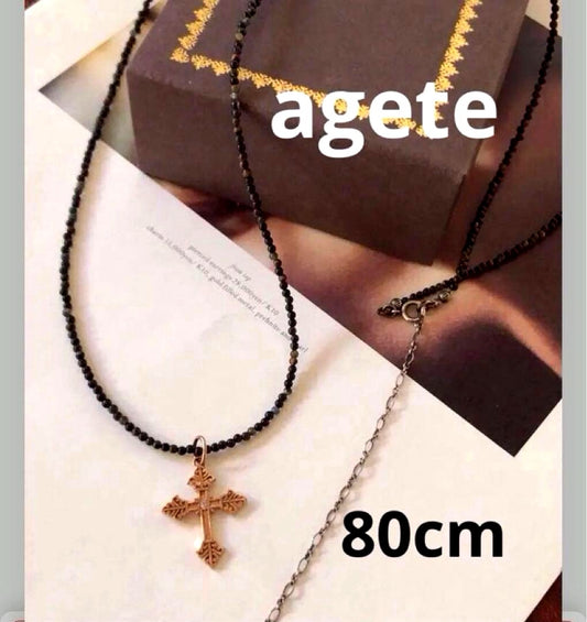 Agete SV Agate long sterling silver necklace with cross charm on white background
